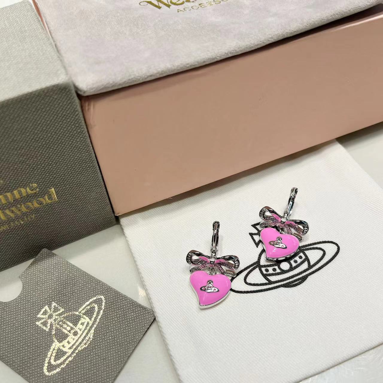 wsxc1789727933084_1 VW Silver-Tone Bow & 3D Enamel Pink Heart Drop Earrings with Saturn Charm - Image 1