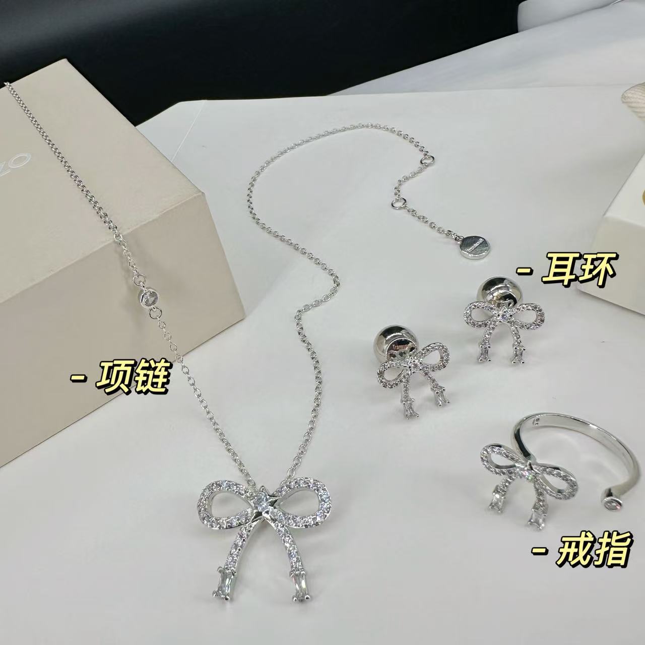 wsxc1789900783013_3 TranslunaR Winking Bow Rhinestone Silver Tone Stud Earrings / Rings / Necklaces - Image 1