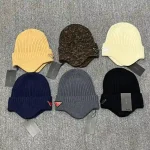 Prada Enamel Metal Triangle Logo Ribbed Knit Beanie with Ear Flaps, 70% Wool Winter Warm Hat, Unisex - Image 4
