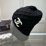 Chanel Knit Beanie:Diagonal diamond cable knit beanie. Color block thick yarn appliqué logo with flecked edge option. - Image 9