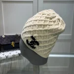 Chanel Knit Beanie:Diagonal diamond cable knit beanie. Color block thick yarn appliqué logo with flecked edge option. - Image 8