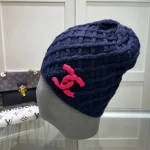 Chanel Knit Beanie:Diagonal diamond cable knit beanie. Color block thick yarn appliqué logo with flecked edge option. - Image 6