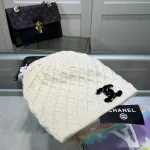 Chanel Knit Beanie:Diagonal diamond cable knit beanie. Color block thick yarn appliqué logo with flecked edge option. - Image 2