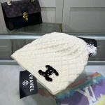 Chanel Knit Beanie:Diagonal diamond cable knit beanie. Color block thick yarn appliqué logo with flecked edge option. - Image 3