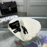 Chanel Knit Beanie:Diagonal diamond cable knit beanie. Color block thick yarn appliqué logo with flecked edge option. - Image 5
