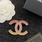 Chanel Double C Gradient Pink Crystal Brooch, Gold tone Metal Pin, Vintage Light Luxury