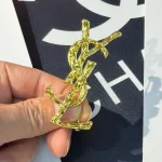 YSL Gold tone Cassandre Metal Brooch, Vintage Twisted Logo Pin, Blazer & Coat Accessory - Image 2