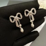 Chanel Sweet CC Logo CZ Bowknot Faux Pearl Drop Earrings-White Gold plated brass