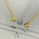 VCA-inspired clover necklace, rhinestone studded center.