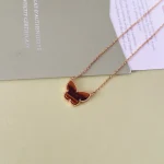 VCA Lucky Alhambra butterfly pendant,  tiger’s eye.