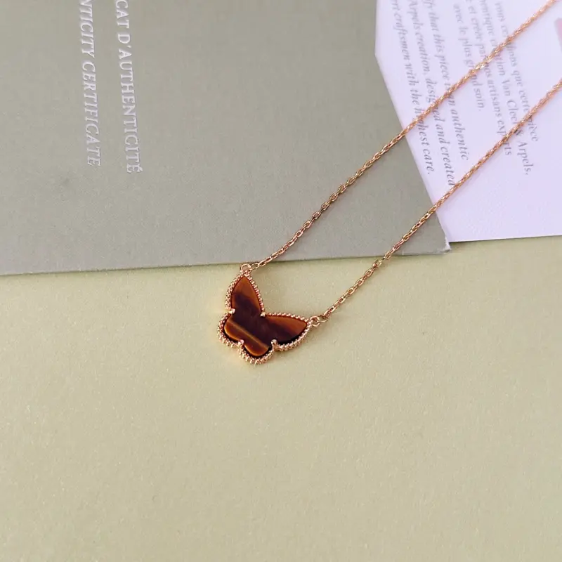wsxc1790765364557_1 VCA Lucky Alhambra butterfly pendant, tiger’s eye. - Image 1